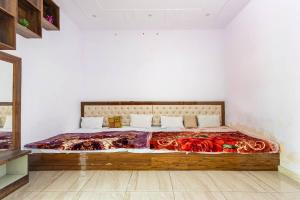 Säng eller sängar i ett rum på Aravali hills resort