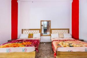 Cama ou camas em um quarto em Aravali hills resort