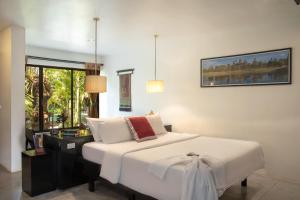 Postel nebo postele na pokoji v ubytování Bunwin Siem Reap
