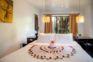 Postel nebo postele na pokoji v ubytování Bunwin Siem Reap