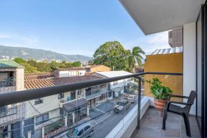 a balcony with a view of a city at MEDELLIN- Cerca al Poblado - 301 in Medellín