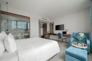 TV a/nebo společenská místnost v ubytování Lupin Boutique Hotel Danang