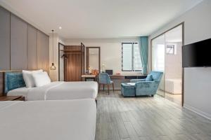 TV a/nebo společenská místnost v ubytování Lupin Boutique Hotel Danang