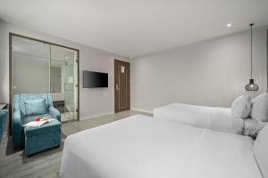 Postel nebo postele na pokoji v ubytování Lupin Boutique Hotel Danang