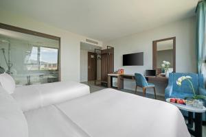 Postel nebo postele na pokoji v ubytování Lupin Boutique Hotel Danang