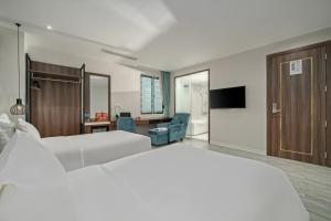 Postel nebo postele na pokoji v ubytování Lupin Boutique Hotel Danang