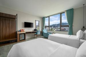 Postel nebo postele na pokoji v ubytování Lupin Boutique Hotel Danang