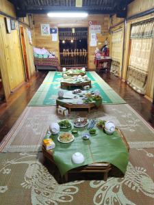a room with a table with food on it at Triệu Chương Homestay in Cao Bằng