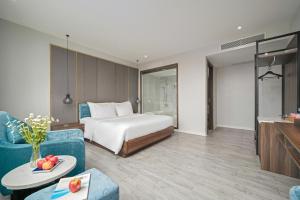 Postel nebo postele na pokoji v ubytování Lupin Boutique Hotel Danang