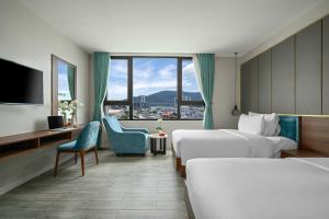 Postel nebo postele na pokoji v ubytování Lupin Boutique Hotel Danang