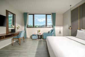 Postel nebo postele na pokoji v ubytování Lupin Boutique Hotel Danang