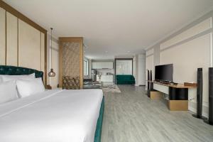 Postel nebo postele na pokoji v ubytování Lupin Boutique Hotel Danang