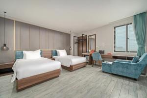 Postel nebo postele na pokoji v ubytování Lupin Boutique Hotel Danang