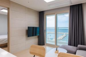 a hotel room with a view of the ocean at Blue12 Yangyang Neos in Yangyang