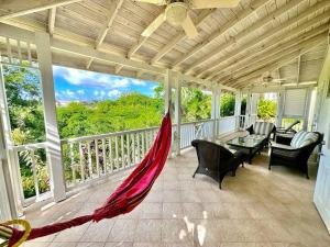 a patio with a hammock on a porch at 122 Vuemont Resorts in Saint Peter