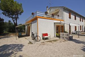 a house with a bike parked in front of it at B&B Sotto le Stelle in Fano