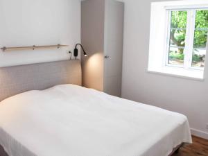 Voodi või voodid majutusasutuse 4 person holiday home in Svaneke toas