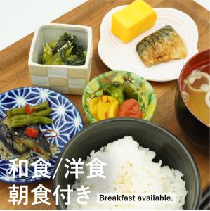 a table topped with plates of food and rice at HOTEL FOURSEASONS KITAKAMI Adult only in Kitakami