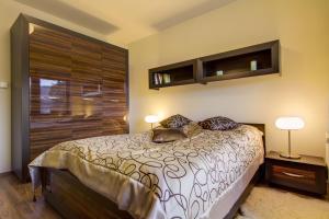 Posteľ alebo postele v izbe v ubytovaní Apartament Storczyk Zakopane