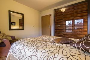 Posteľ alebo postele v izbe v ubytovaní Apartament Storczyk Zakopane