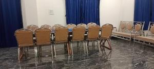 a row of chairs lined up in a room at HSV WONDER WORLD,FARM HOUSES in Venkatāpur