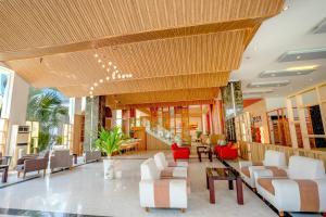 a lobby of a hotel with chairs and tables at Tuana Hotels Cam Ranh Resort in Cam Lâm +53 photos