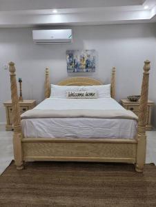 a bedroom with a bed with a white bedspread at Beachscape At Black River Ethlyn by the sea in Black River