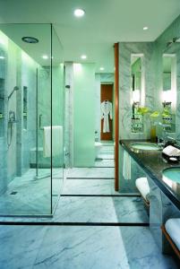 a bathroom with two sinks and a shower at Hyatt Regency Dongguan in Dongguan