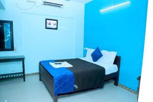 a bed or beds in a room at blue moon hotel at Sooryas Hotels & Resorts in Kottakupam