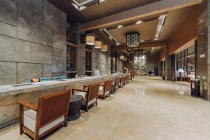 Restoran või mõni muu söögikoht majutusasutuses Merlinhood Hotel Guangzhou Xiajiao Metro Station Shaxi International Hotel Supplies City
