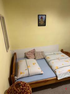 two beds sitting next to each other in a room at Penzión Bardejov pri Nemocnici in Bardejov