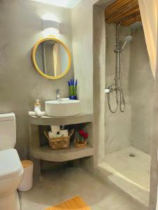 a bathroom with a sink and a shower at Aegean Serenity - Sea View Retreat in Archangelos