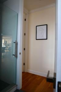 a hallway with a glass door and a picture on the wall at Apartment in New York By Central Park in New York