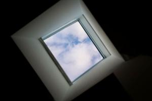 a window in a ceiling with a sky at Apartment in New York By Central Park in New York