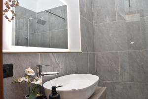 a bathroom with a white tub and a sink at Diasof Apartments in Rome