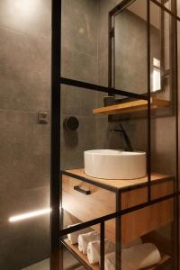 a bathroom with a sink and a shower at Giovi Central Apartment in Cluj-Napoca