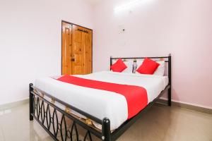 Postel nebo postele na pokoji v ubytování OYO Madgaon Holidays