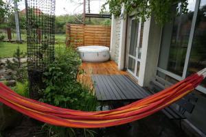 a hammock on the porch of a house at Immaculate 2-Bed Apartment in Zywiec in Żywiec