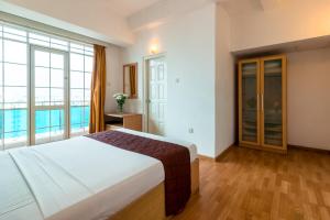 Voodi või voodid majutusasutuse Global Towers Hotel & Apartments toas