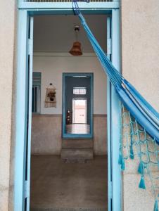 una puerta abierta de un edificio con un pasillo en Shanthi House, en Mysore