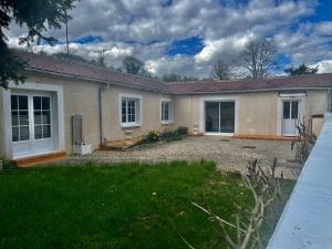 a house with a large driveway in front of it at Anny & Bernard in Trucy-sur-Yonne