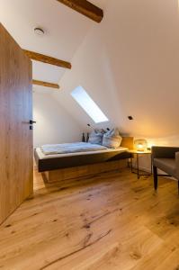 a bedroom with a bed with a skylight at Ferienwohnung Geilert in Leisnig