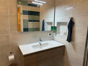 a bathroom with a sink and a mirror at B&B Casa Limone in Limone sul Garda +66 photos