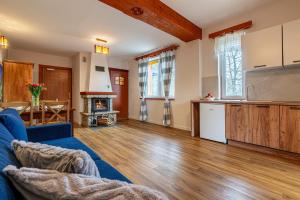 Kuchyňa alebo kuchynka v ubytovaní Apartamenty pod Słońcem