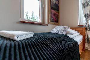 Posteľ alebo postele v izbe v ubytovaní Apartamenty pod Słońcem