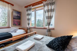 Posteľ alebo postele v izbe v ubytovaní Apartamenty pod Słońcem