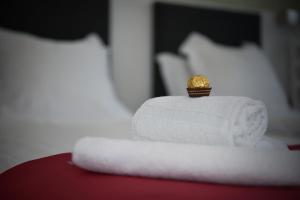 Voodi või voodid majutusasutuse Hotel La Croix Blanche - Bassecourt toas