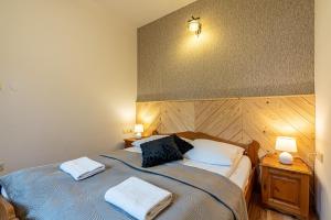 Posteľ alebo postele v izbe v ubytovaní Apartamenty pod Słońcem