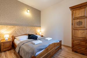 Posteľ alebo postele v izbe v ubytovaní Apartamenty pod Słońcem