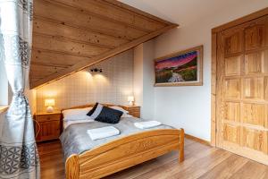 Posteľ alebo postele v izbe v ubytovaní Apartamenty pod Słońcem